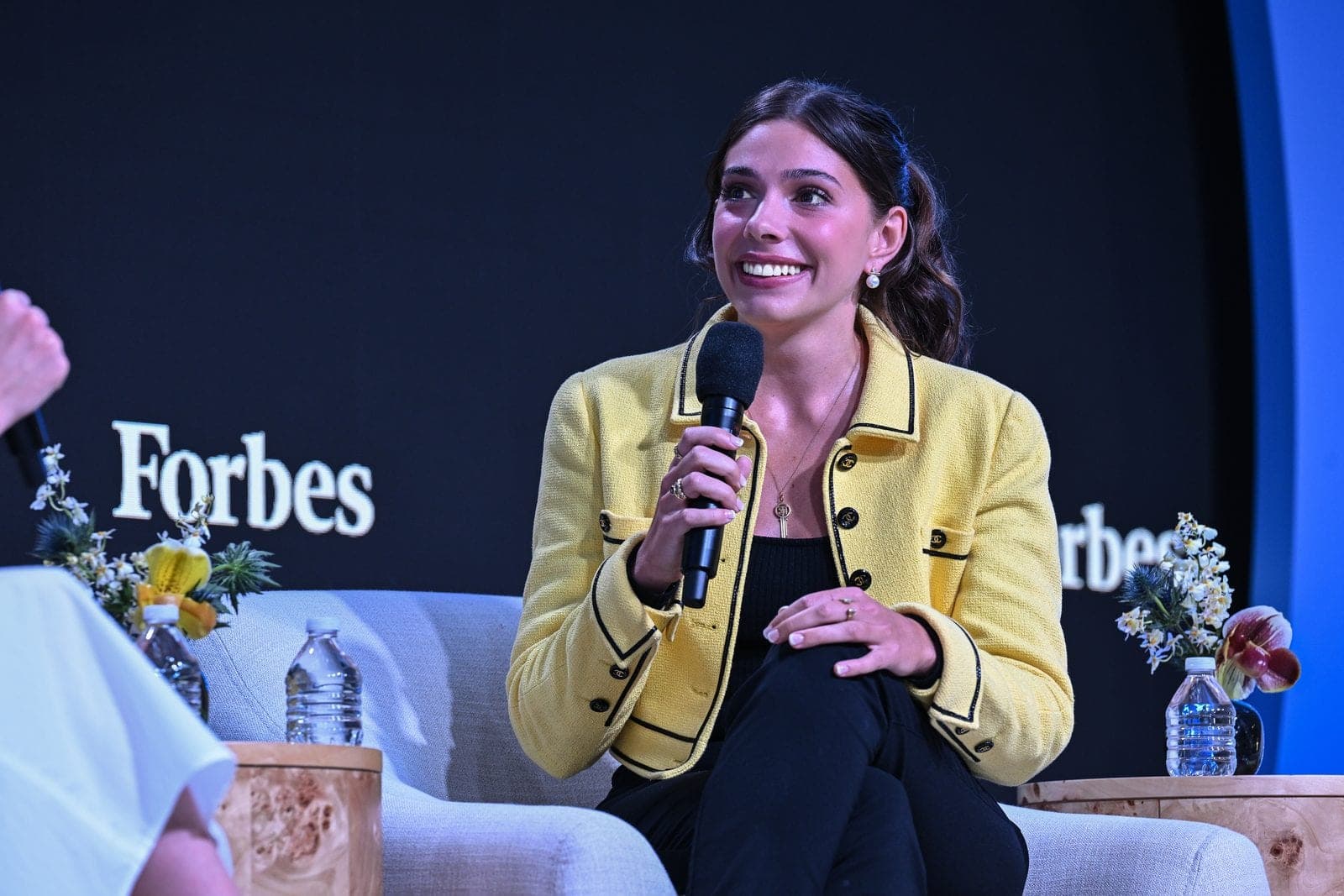 Taylor Price speaking on stage at the Forbes Creator Upfronts